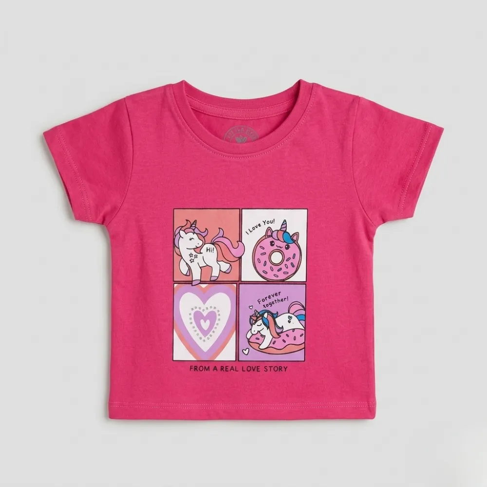 Pink baby t-shirt with a cartoon unicorn and donut graphic, featuring a love story theme.