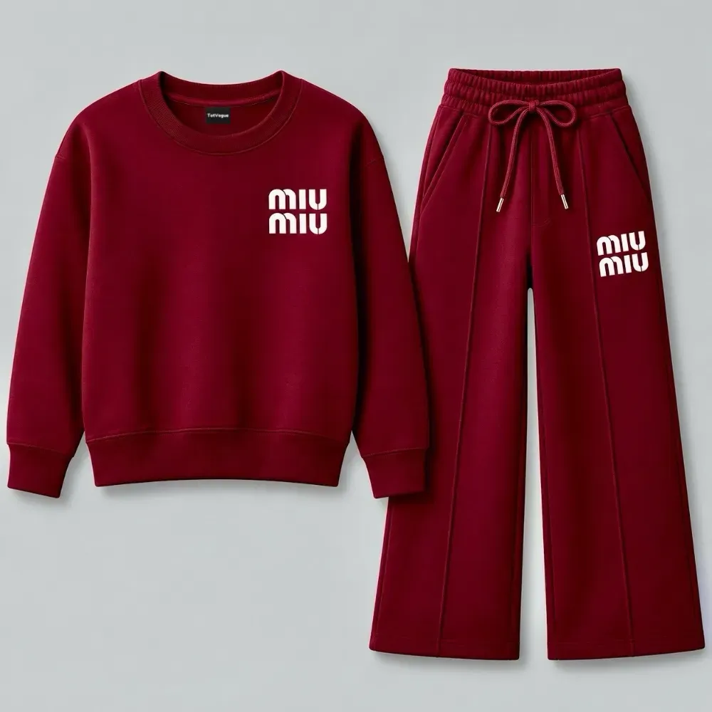 A burgundy red two-piece tracksuit for women featuring a crewneck sweatshirt and wide-leg sweatpants with white Miu Miu branding
