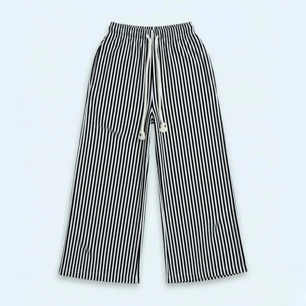 Black and white striped pants with elastic waist and drawstring tie.