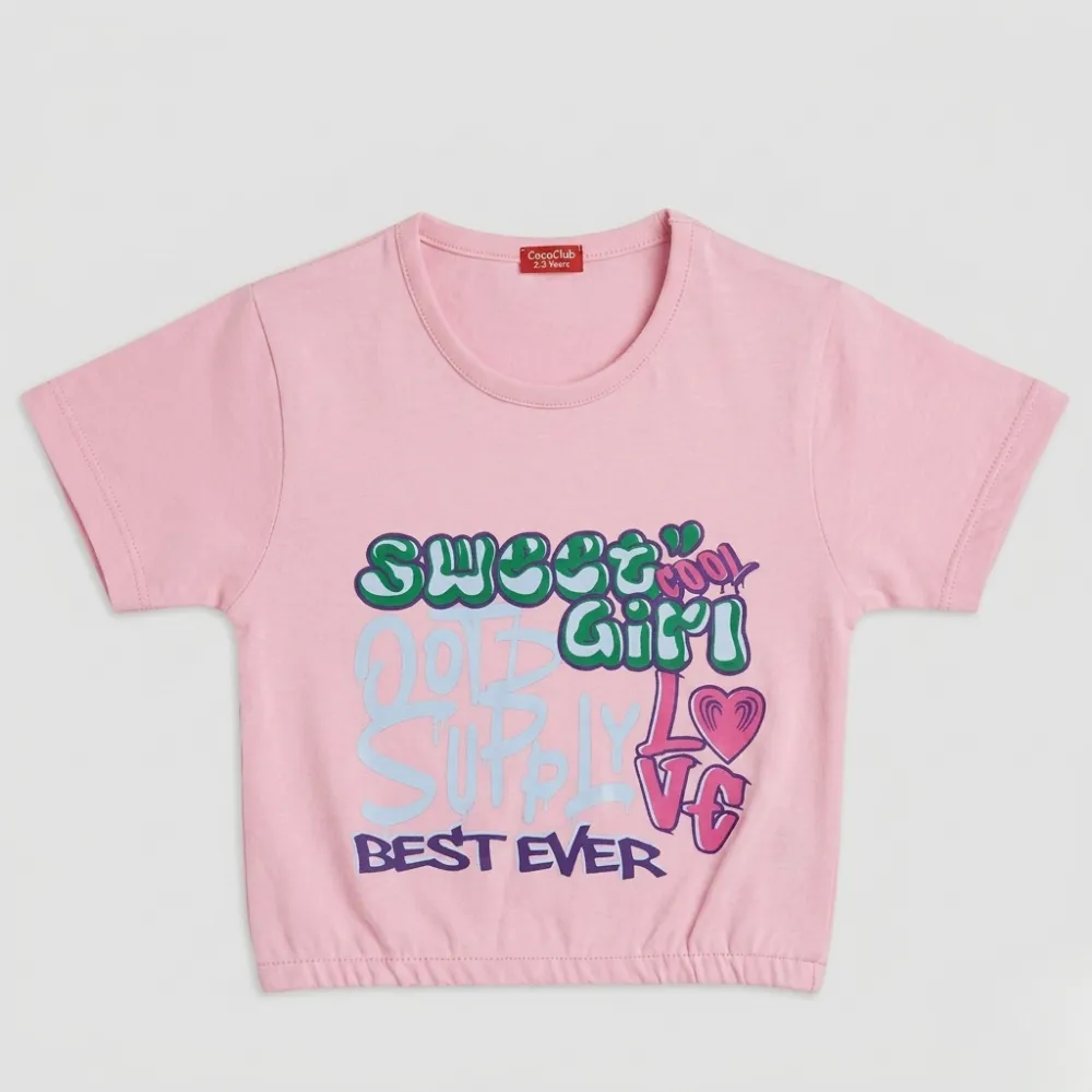 Pink cropped t-shirt with colorful graffiti text reading 'Sweet Girl Don't Supply Best Ever'
