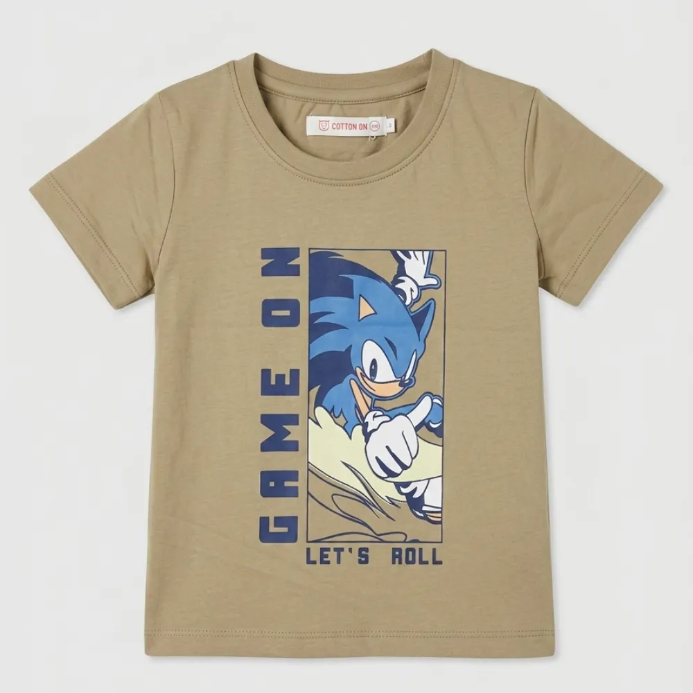 Kids beige short-sleeved t-shirt with a graphic of Sonic the Hedgehog and the text 'GAME ON LET'S ROLL' in blue.