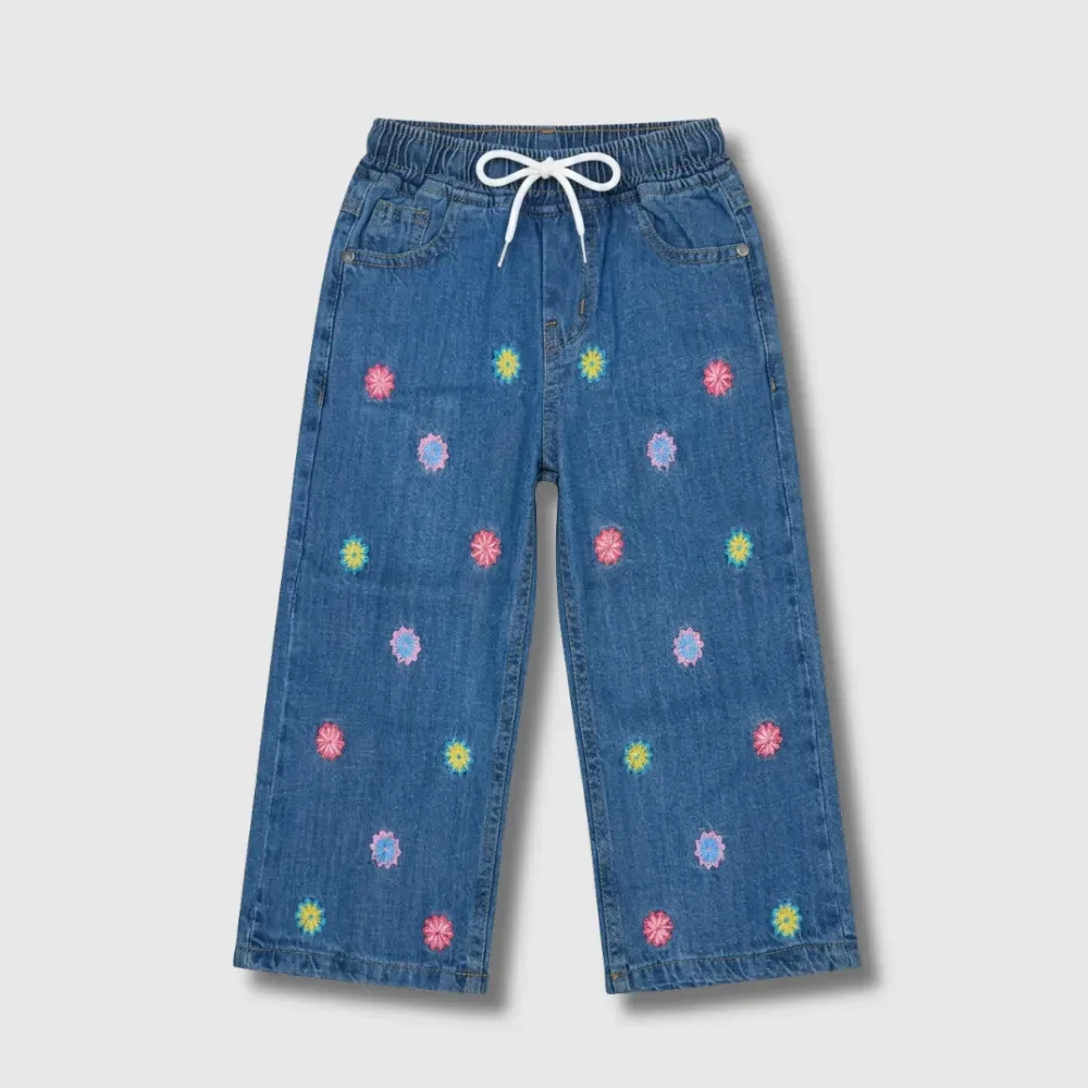 Blue denim pants with colorful floral embroidery and elastic waistband.