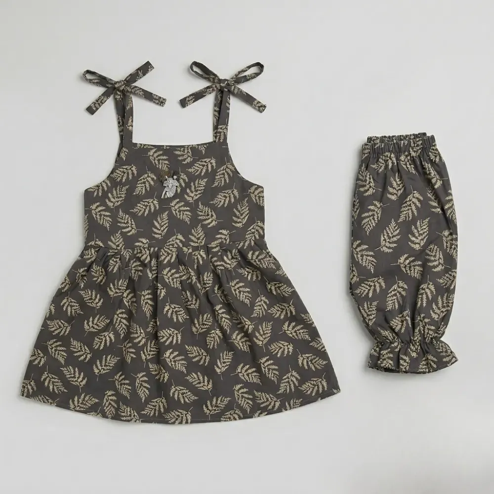 Gray sleeveless top and pants set with white fern leaf pattern, bows on straps.