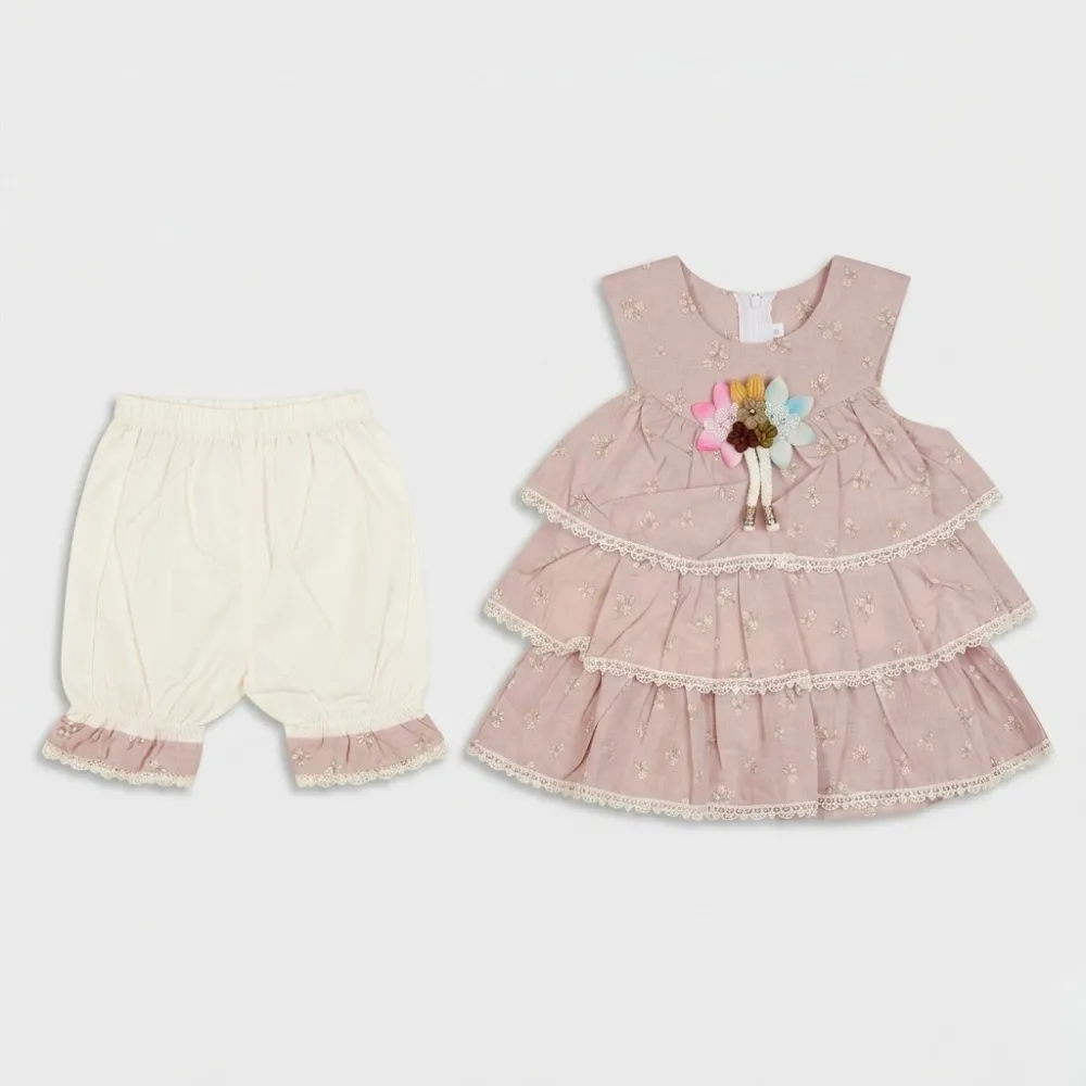 Pink baby girl dress with floral design and white baby pants with pink and lace trim