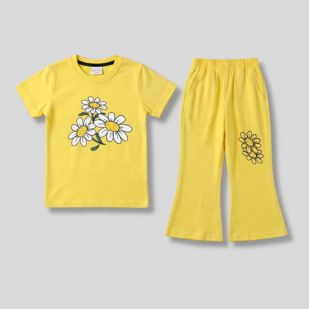 Yellow short-sleeved t-shirt and matching pants set with white daisy print on the shirt and black daisy print on the pants.