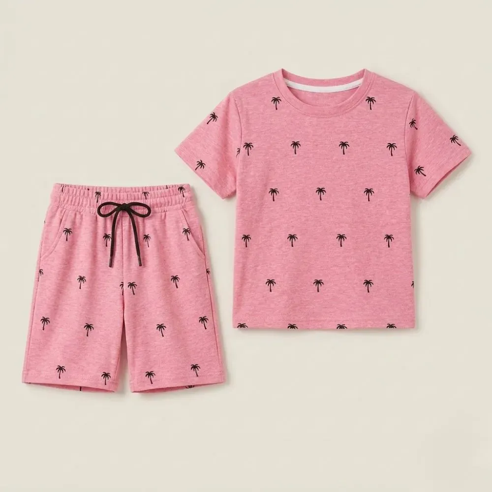 Pink short sleeve shirt and shorts set with black palm tree print, made of soft material.